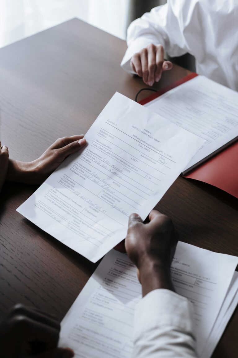 Stock photo of two individuals reviewing a legal document together
