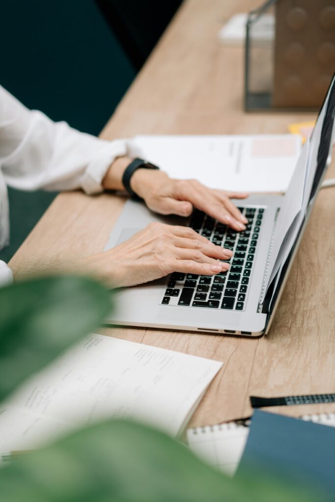 Stock photo of person typing on a laptop